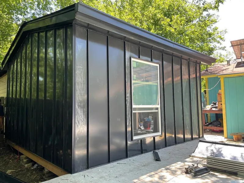 Black standing seam metal wall panels for Roof Inspection in Puyallup